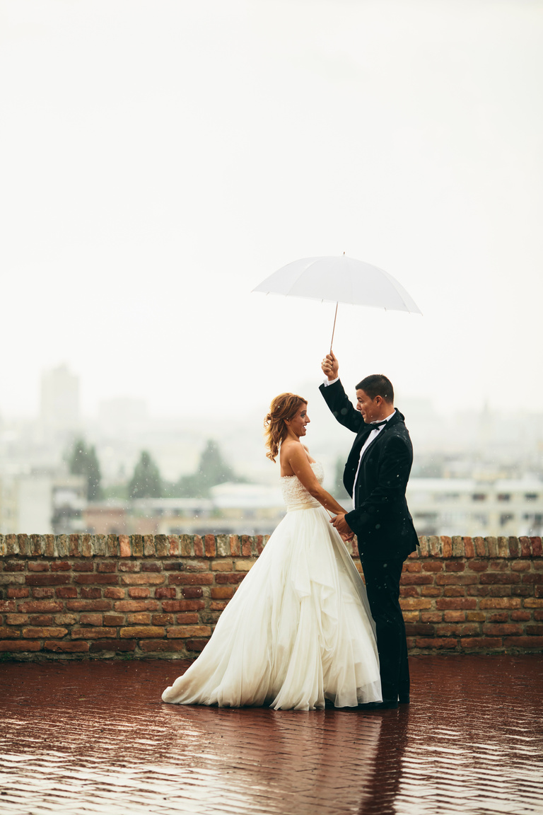 Happy Wedding Couple in the Rain